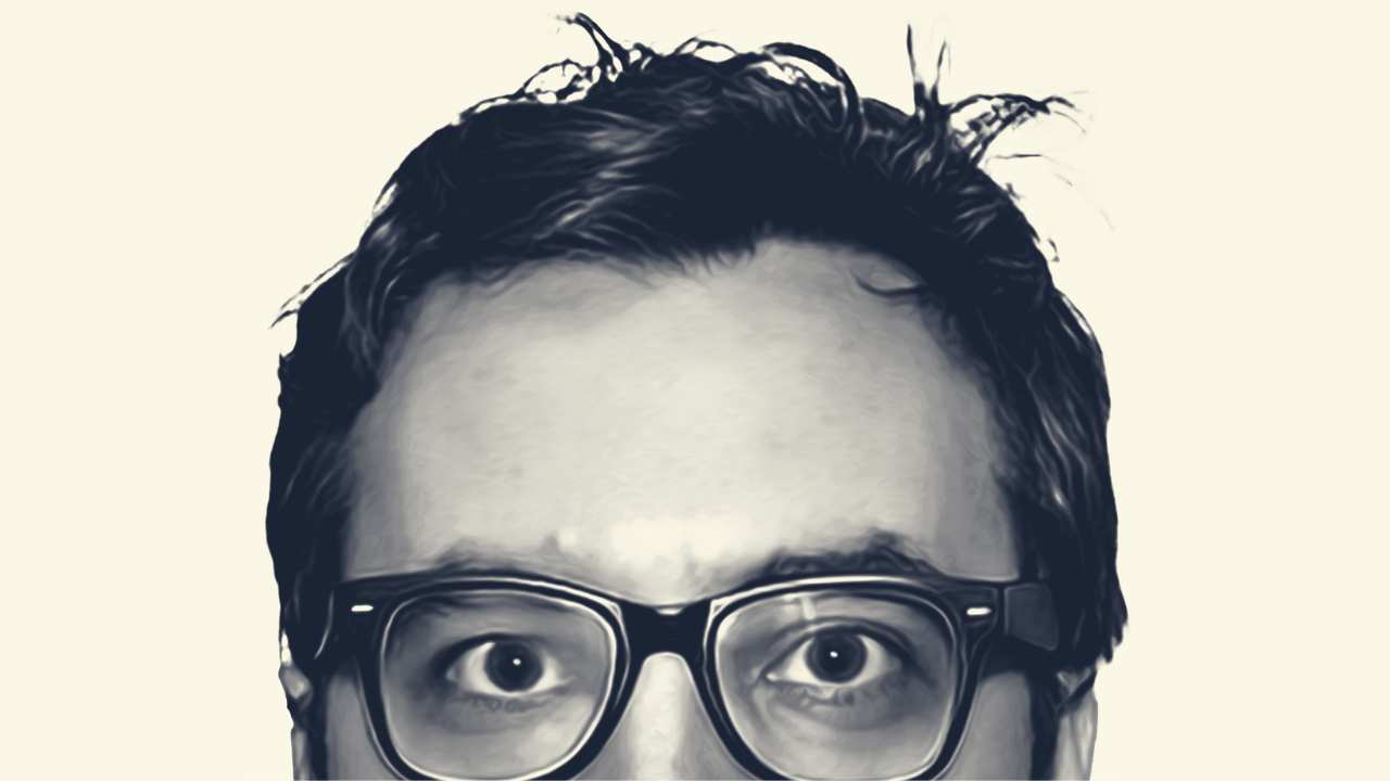 the top of a man's face with glasses